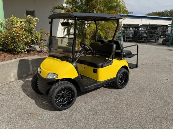 2020 E-Z-GO Freedom RXV Elite Lithium 4 Passenger Golf Cart (Yellow, Gloss Black Wheels) at Oxford Golf Cars